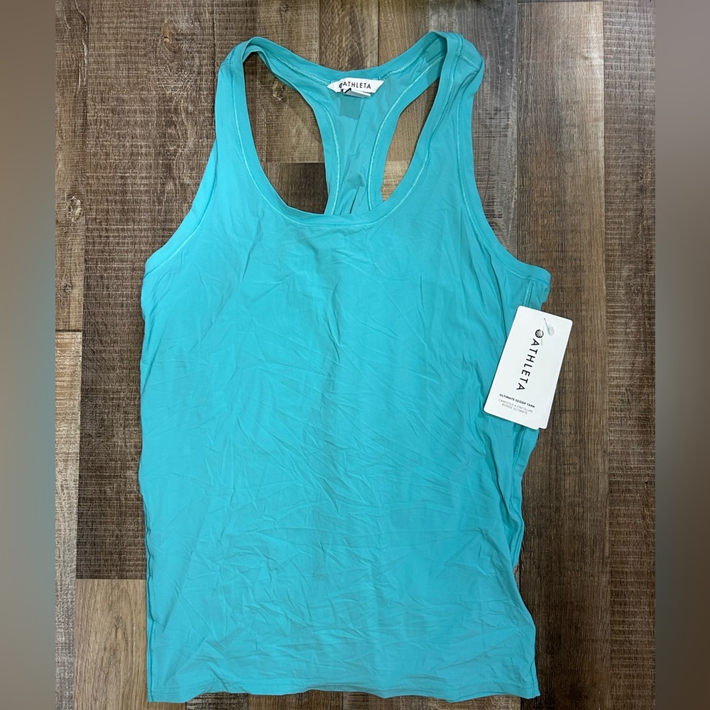 NWT Athleta Top with Breathable Fabric and Versatile Design